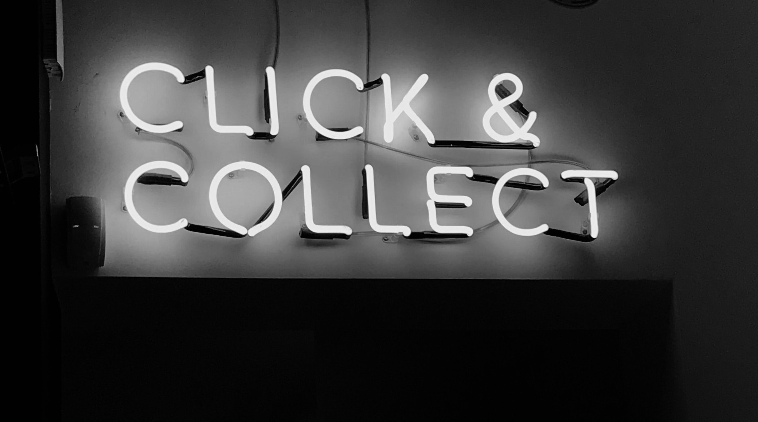 An electric sign that says click and connect.