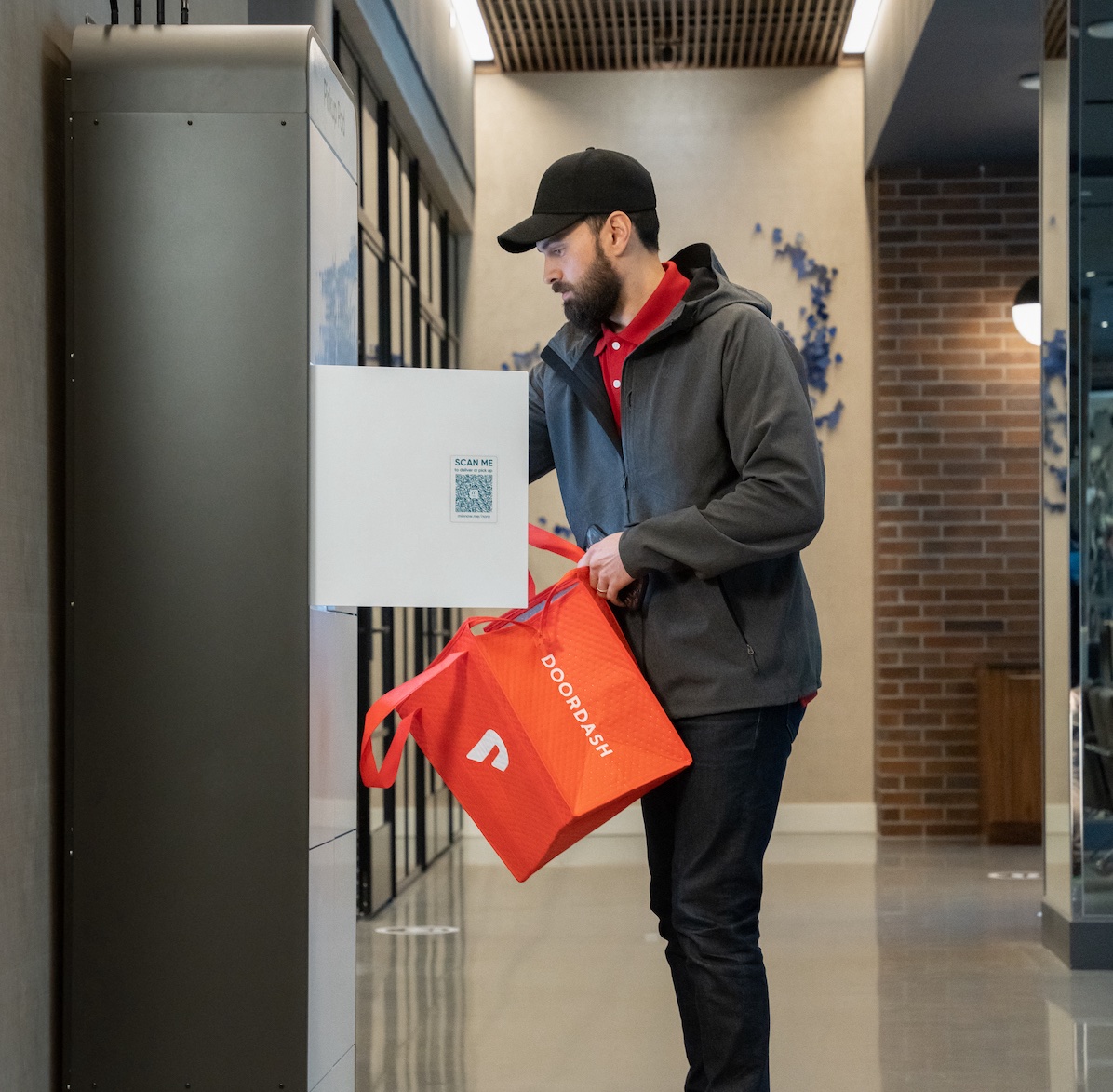 A foodservice delivery courier delivering food to a Minnow Pickup Pod.