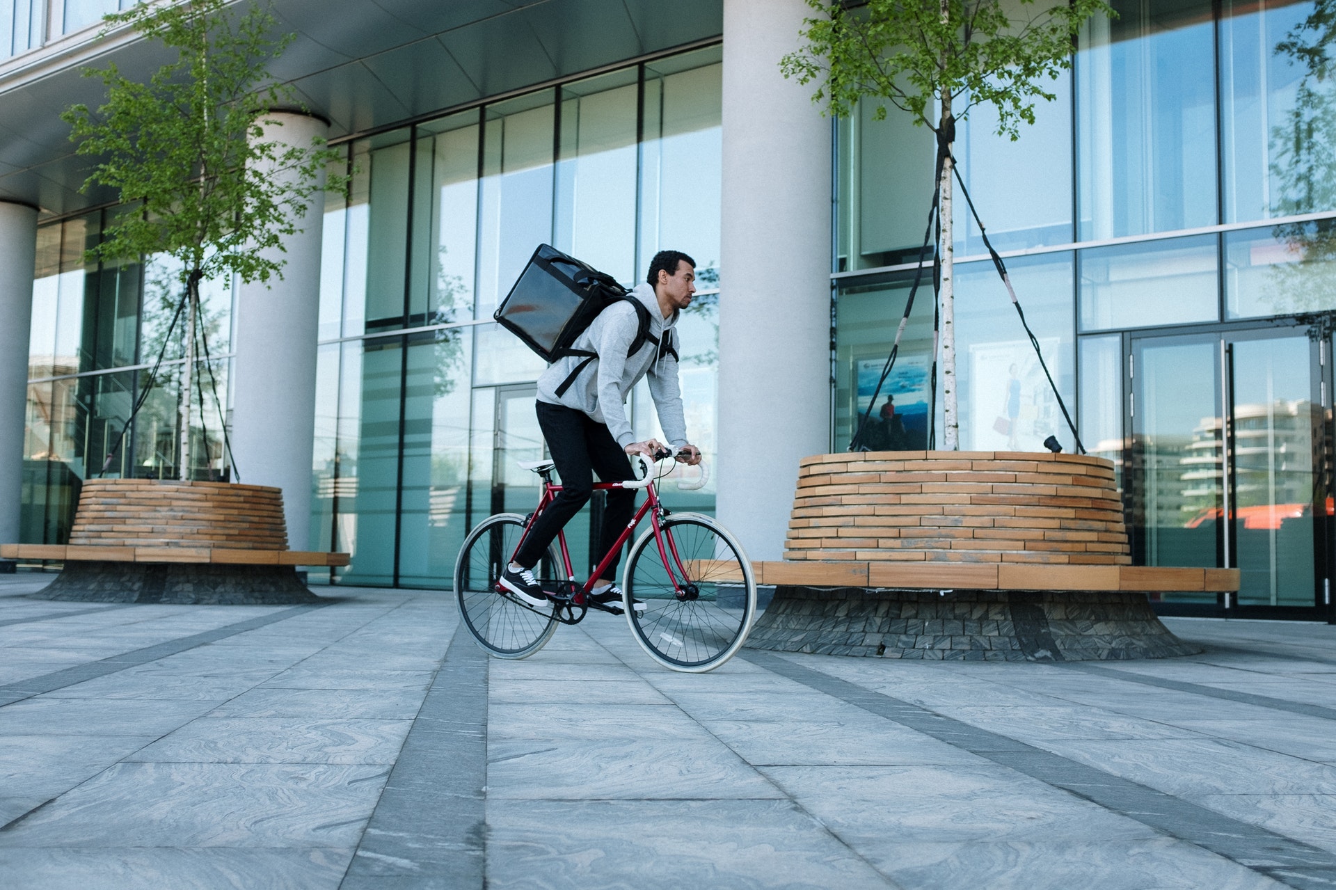 A food delivery worker on a bike.